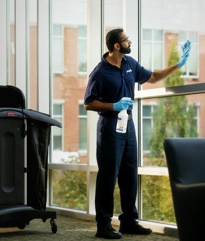 ABM employees wiping down lockers and keeping school spaces clean