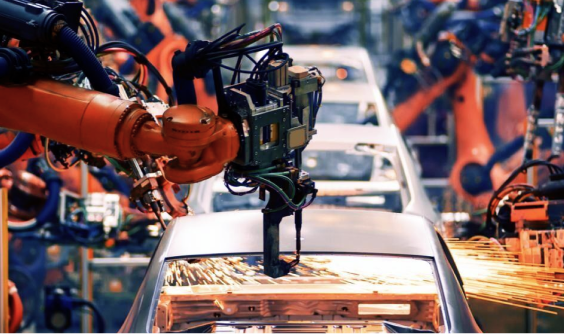 A auto plant robot arm working building a car